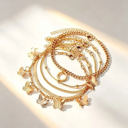 Women's 5-Piece Adjustable Stackable Bracelets Set, Dainty Gold Tone Minimalist Chain Bracelet with Butterfly Charm, Durable Metal for Layering & Everyday Casual Streetwear.